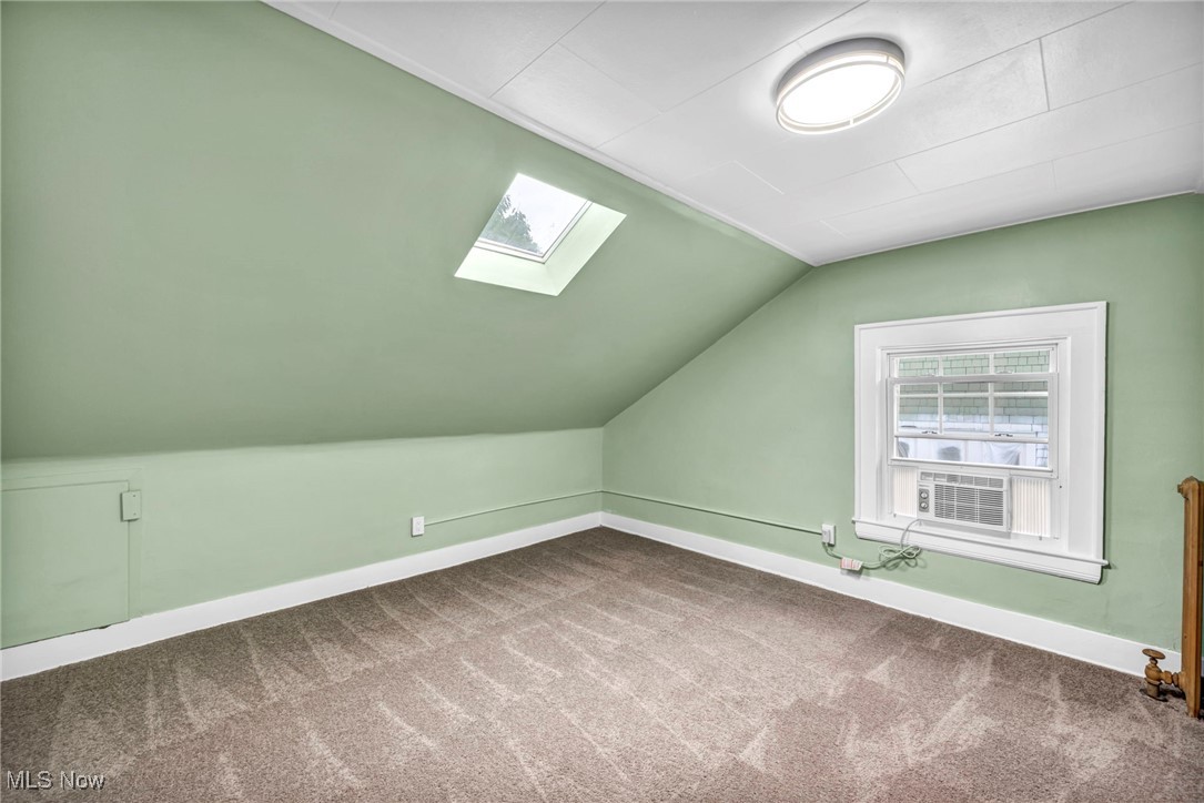 2980 East Overlook Road Cleveland, OH 44118 - Photo 37 of 49 Bonus room featuring carpet and lofted ceiling with skylight
