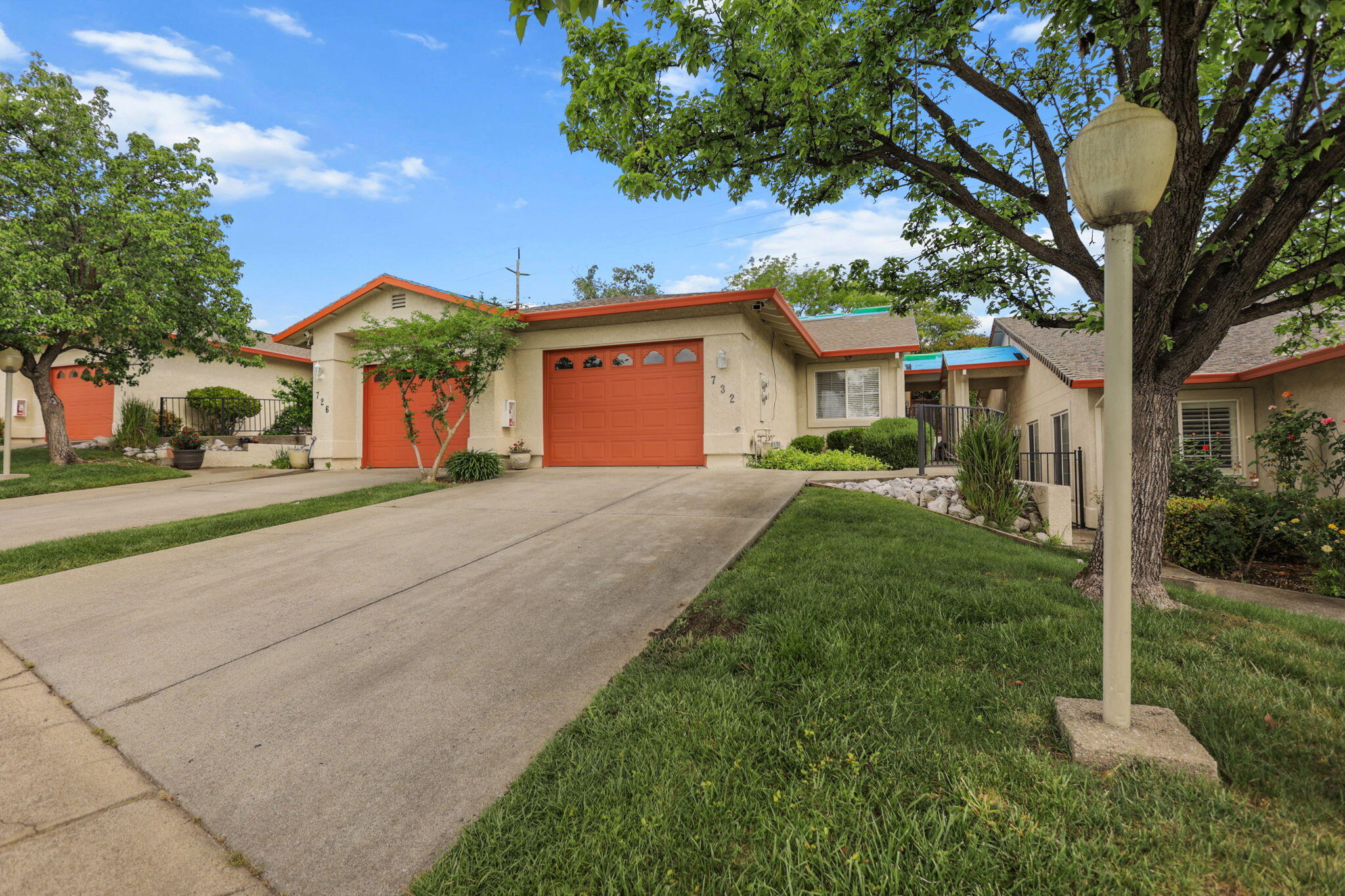 732 Stonebriar Trail Redding, CA 96003 - Photo 1 of 18 a front view of a house with a yard and trees