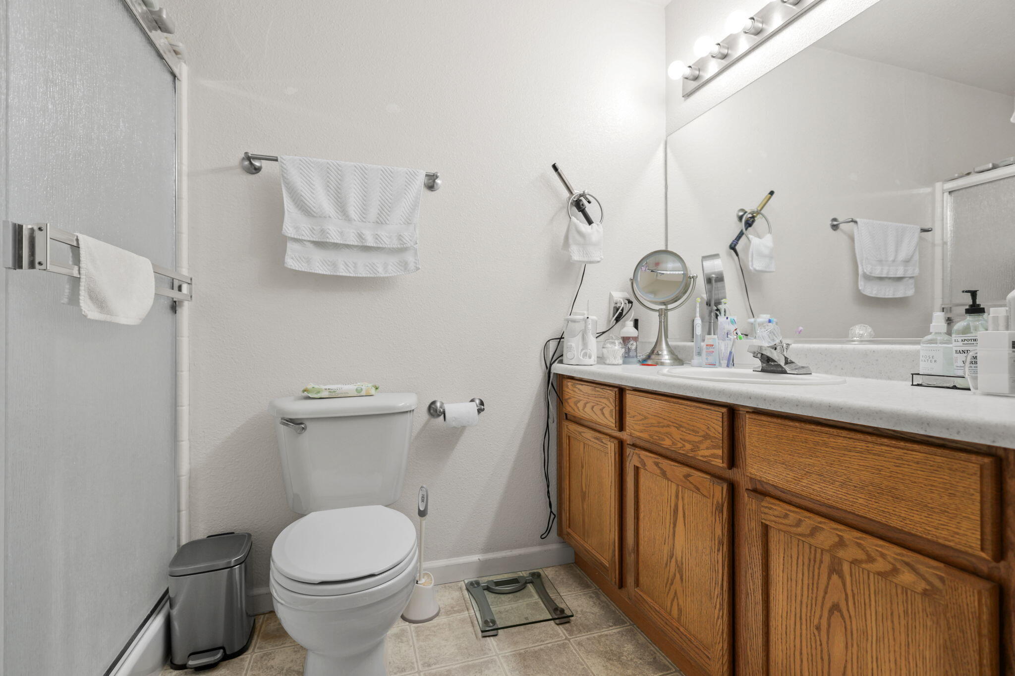 732 Stonebriar Trail Redding, CA 96003 - Photo 11 of 18 a bathroom with a granite countertop toilet sink and mirror
