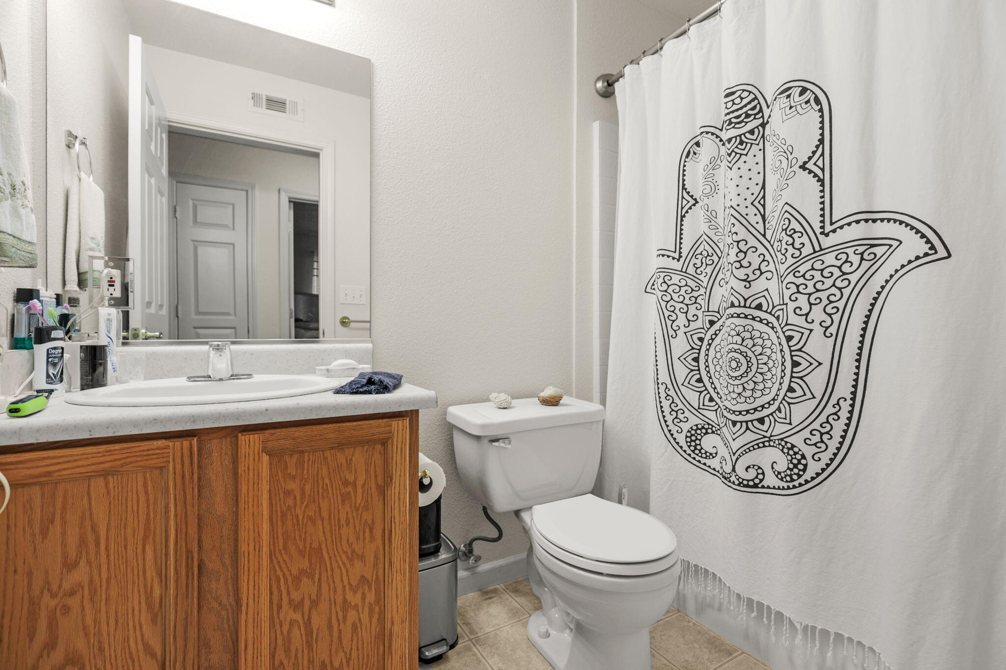 732 Stonebriar Trail Redding, CA 96003 - Photo 13 of 18 a bathroom with a toilet sink and mirror
