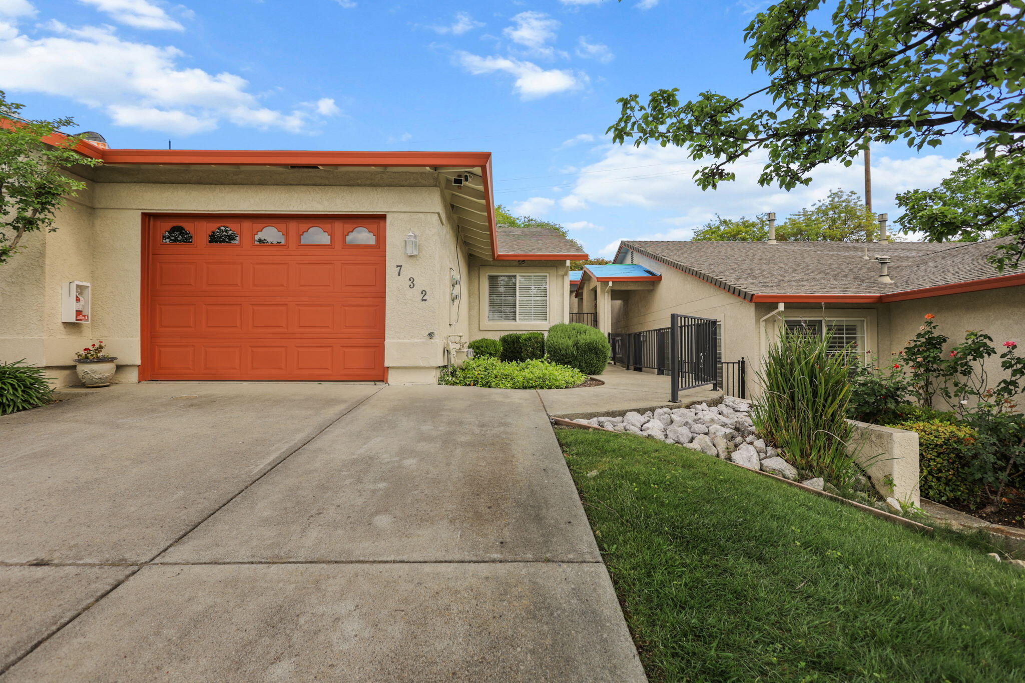 732 Stonebriar Trail Redding, CA 96003 - Photo 16 of 18 a front view of a house with a garden