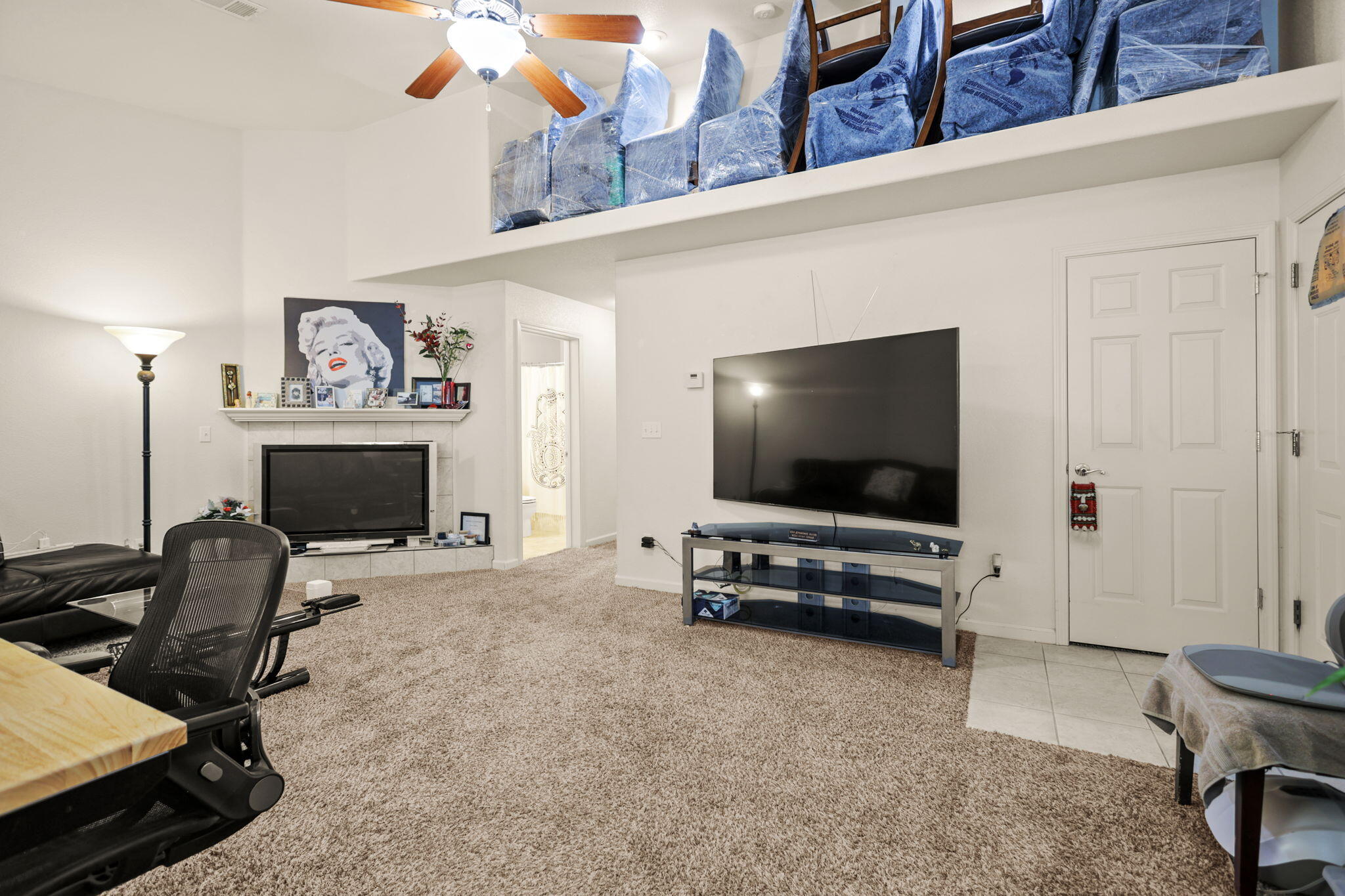 732 Stonebriar Trail Redding, CA 96003 - Photo 5 of 18 a living room with furniture and a flat screen tv