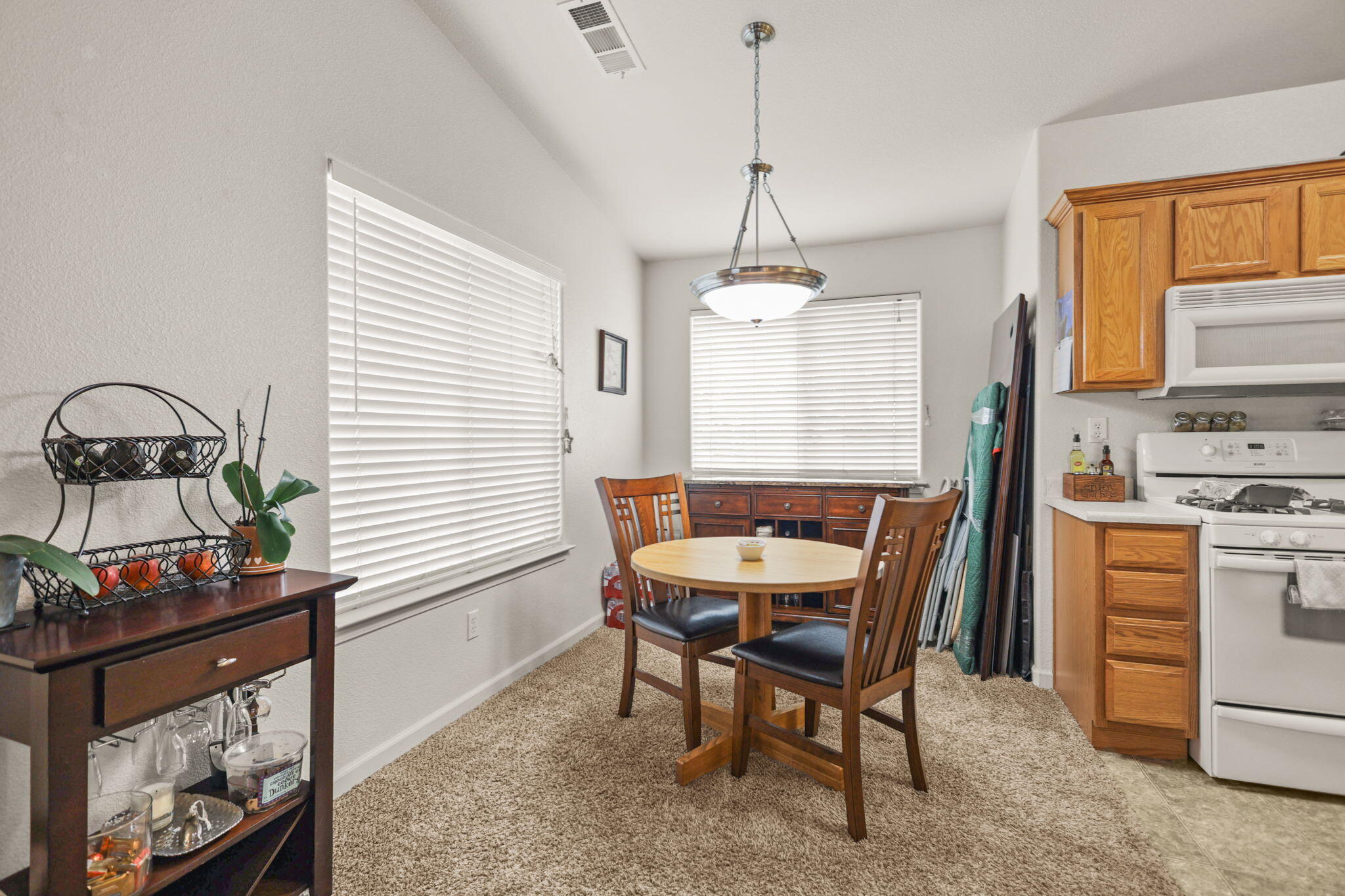 732 Stonebriar Trail Redding, CA 96003 - Photo 6 of 18 a view of a dining room with furniture window and outside view