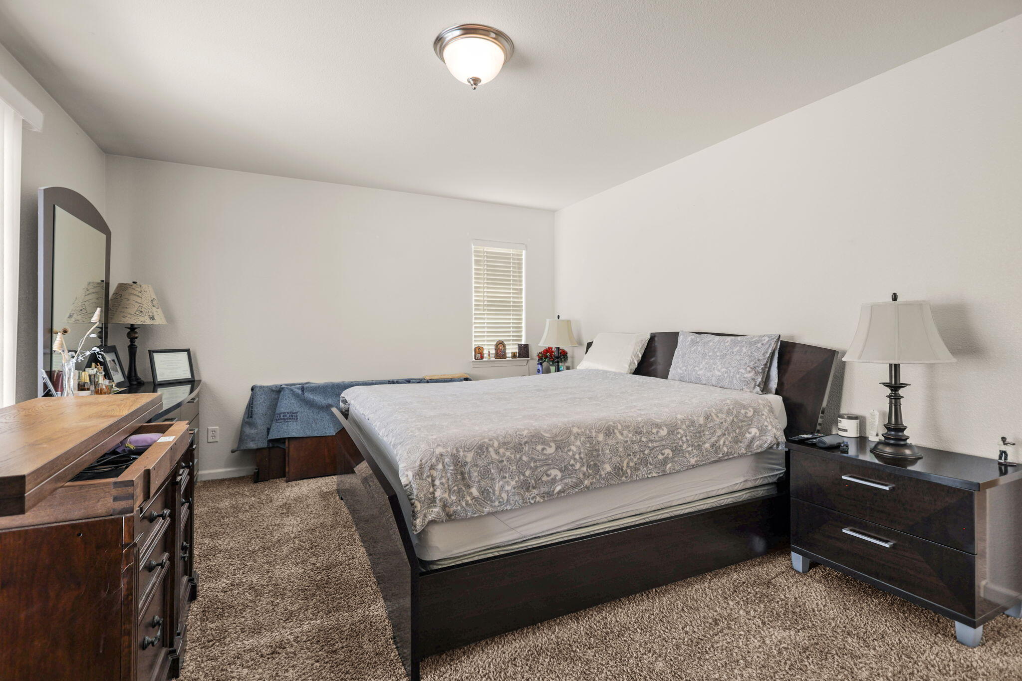 732 Stonebriar Trail Redding, CA 96003 - Photo 9 of 18 a bedroom with a bed and wooden floor
