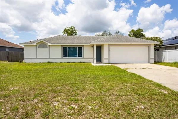 a front view of a house with yard