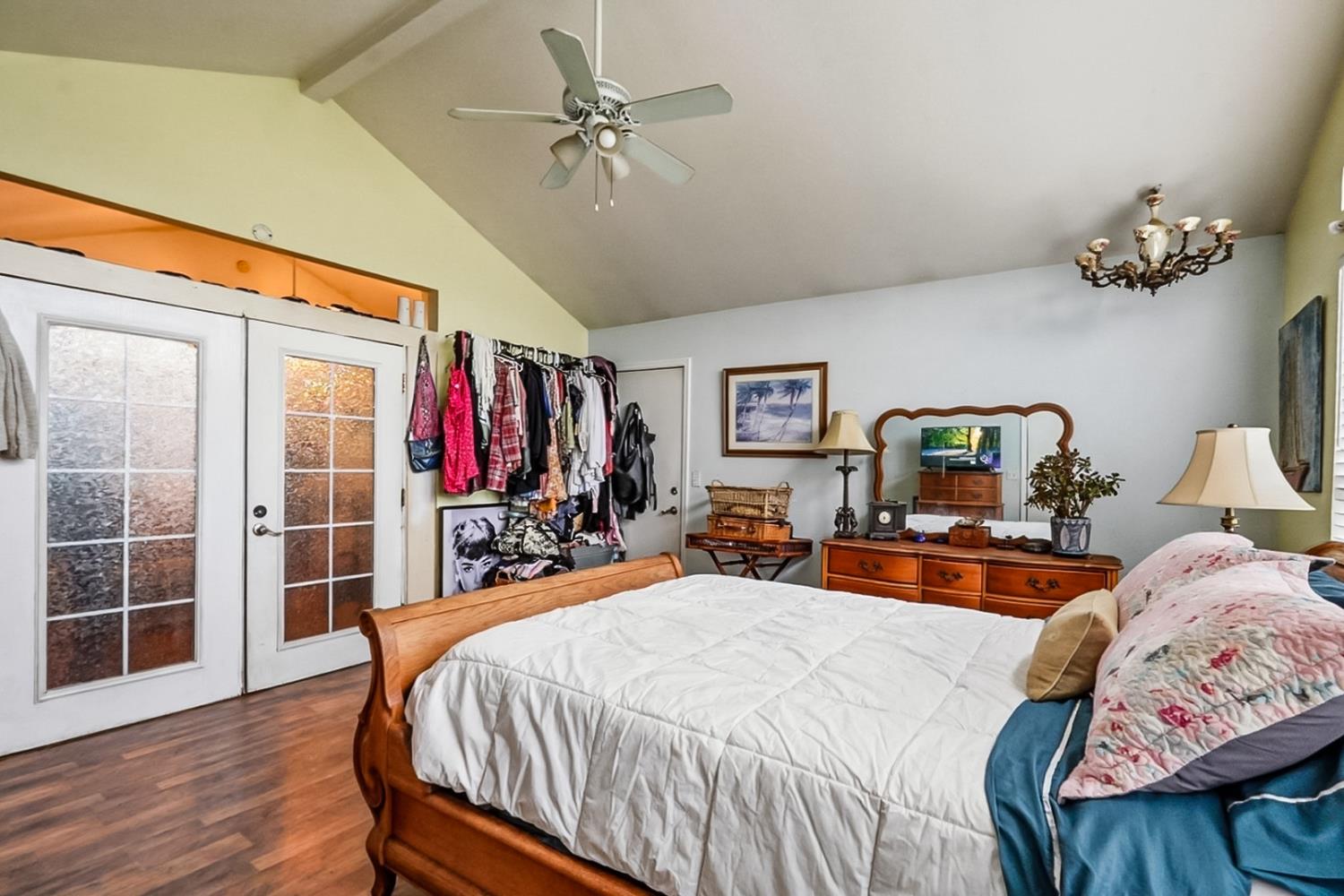 1829 River Road Modesto, CA 95351 - Photo 11 of 44 a bed room with a bed and a mirror