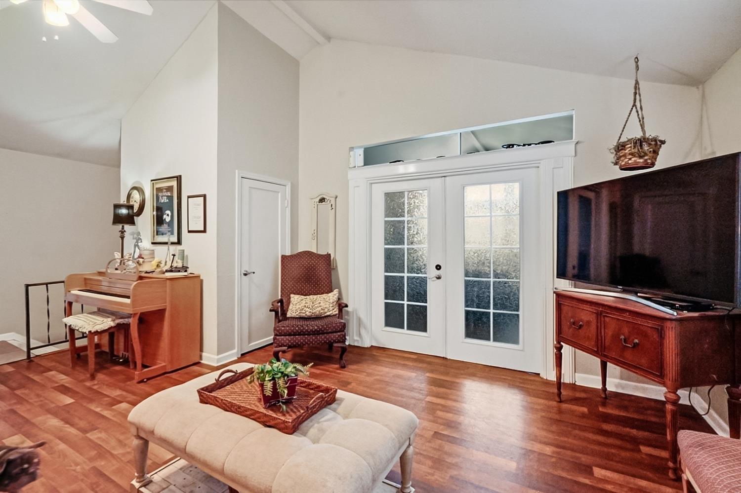 1829 River Road Modesto, CA 95351 - Photo 23 of 44 a living room with furniture and a flat screen tv