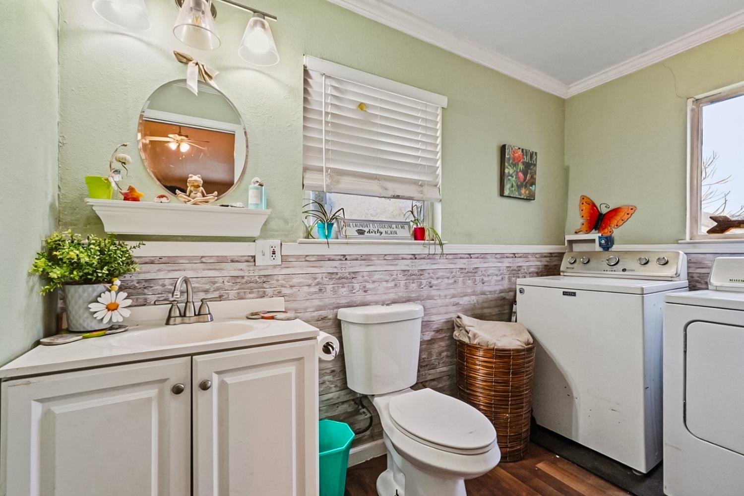 1829 River Road Modesto, CA 95351 - Photo 28 of 44 a bathroom with a toilet sink and mirror