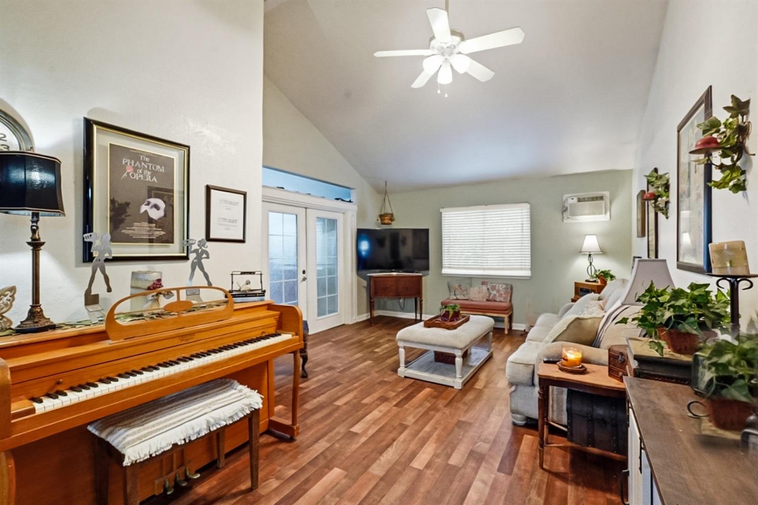 1829 River Road Modesto, CA 95351 - Photo 29 of 44 a room with furniture and wooden floor