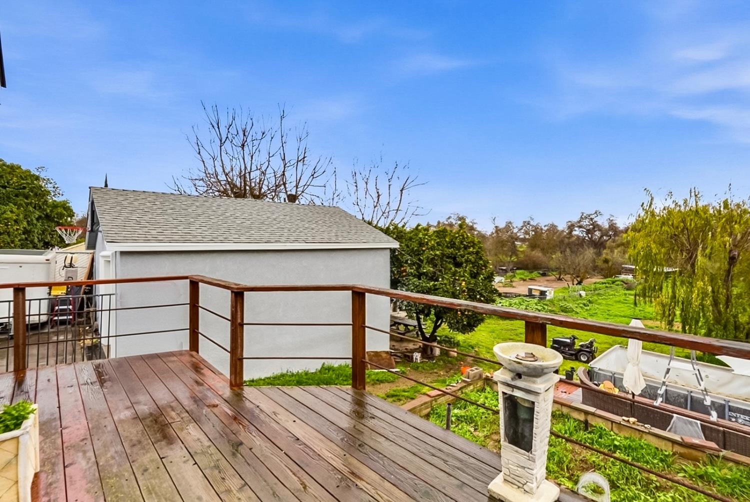 1829 River Road Modesto, CA 95351 - Photo 30 of 44 a view of a balcony with mountain view and wooden floor