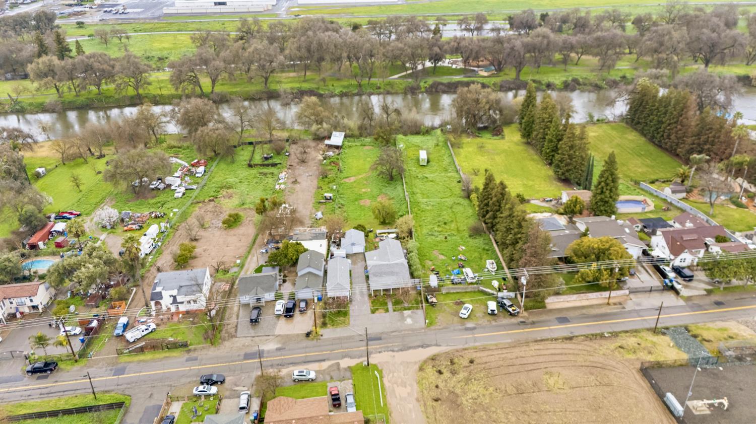 1829 River Road Modesto, CA 95351 - Photo 31 of 44 an aerial view of residential houses with outdoor space and lake view