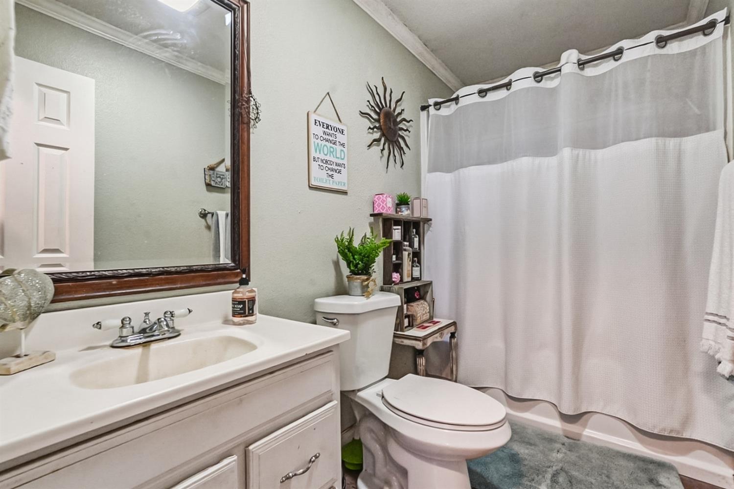 1829 River Road Modesto, CA 95351 - Photo 33 of 44 a bathroom with a sink toilet and shower