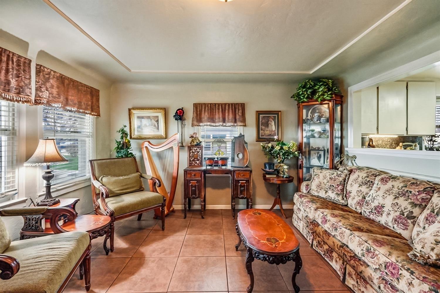 1829 River Road Modesto, CA 95351 - Photo 39 of 44 a living room with furniture and a flat screen tv