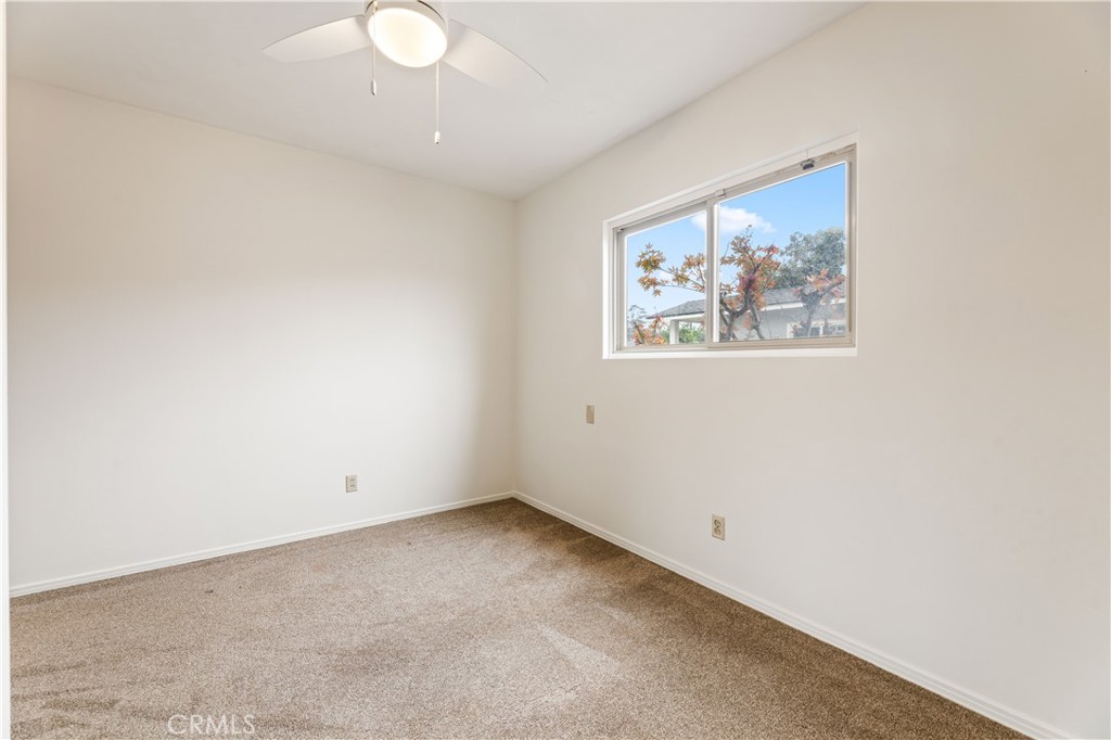 9063 Gotham Street Downey, CA 90241 - Photo 15 of 45 an empty room with a painting on the wall