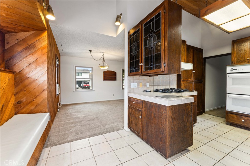 9063 Gotham Street Downey, CA 90241 - Photo 18 of 45 a kitchen with stainless steel appliances granite countertop a stove and a sink