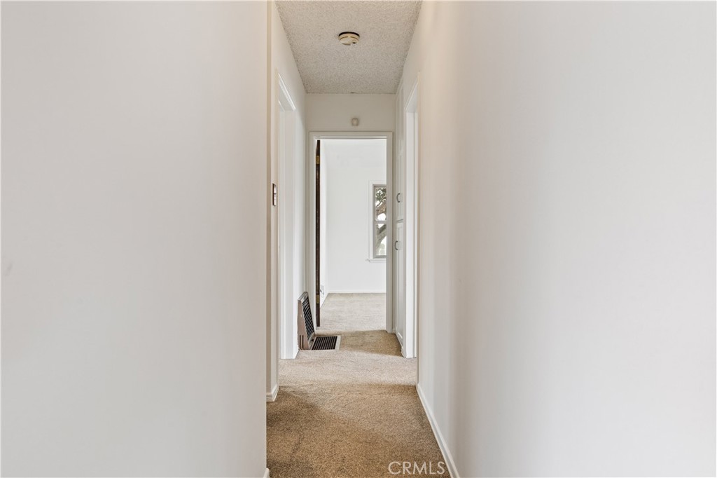 9063 Gotham Street Downey, CA 90241 - Photo 39 of 45 a view of a bathroom from a corridor