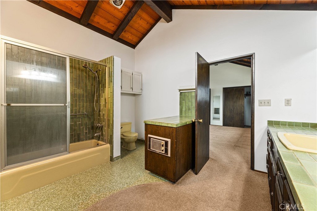 9063 Gotham Street Downey, CA 90241 - Photo 8 of 45 a view of a kitchen with stainless steel appliances wooden floor and a living room