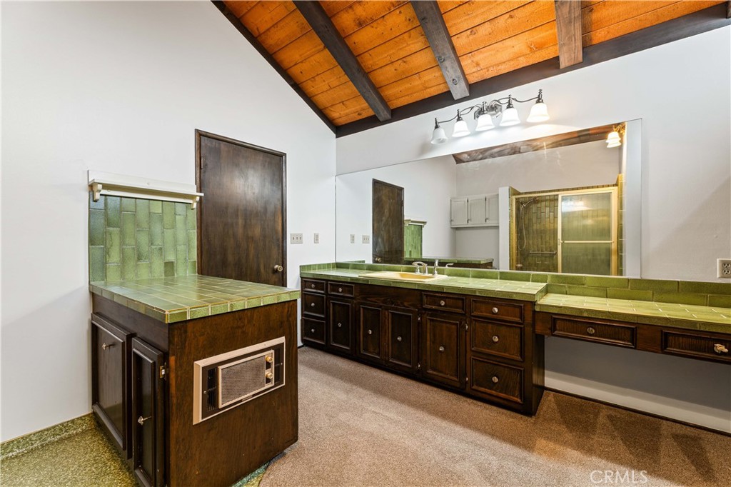9063 Gotham Street Downey, CA 90241 - Photo 10 of 45 a spacious bathroom with a granite countertop sink and a large mirror