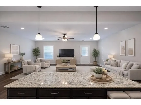 a living room with furniture kitchen view and a chandelier