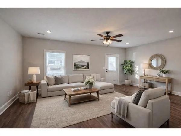 a living room with furniture and a large window
