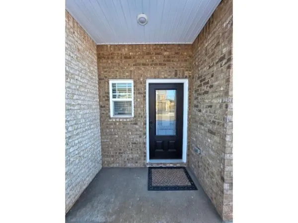 a view of front door of a house with windows