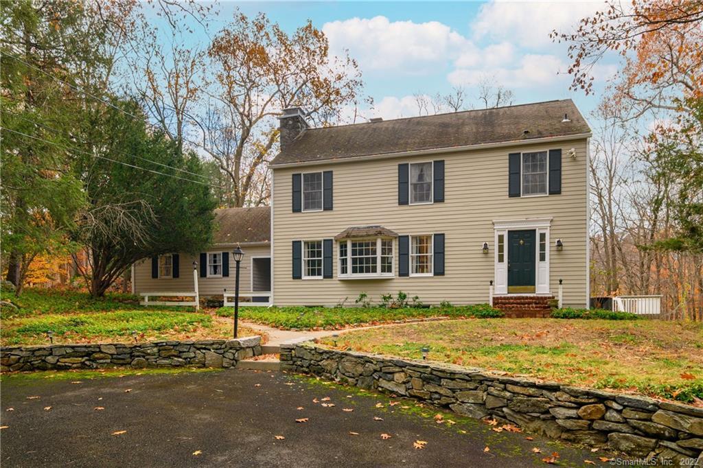29 Plumtrees Road Newtown, CT 06470 - Photo 1 of 1 a front view of a house with a yard