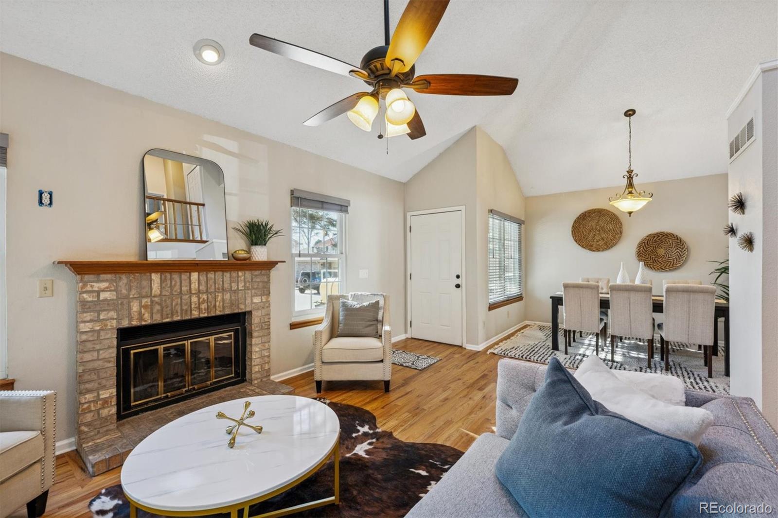 2002 South Xenia Way Denver, CO 80231 - Photo 4 of 23 a living room with furniture and a fireplace