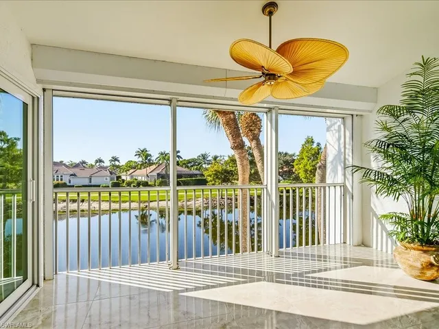 a view of a balcony with floor to ceiling window