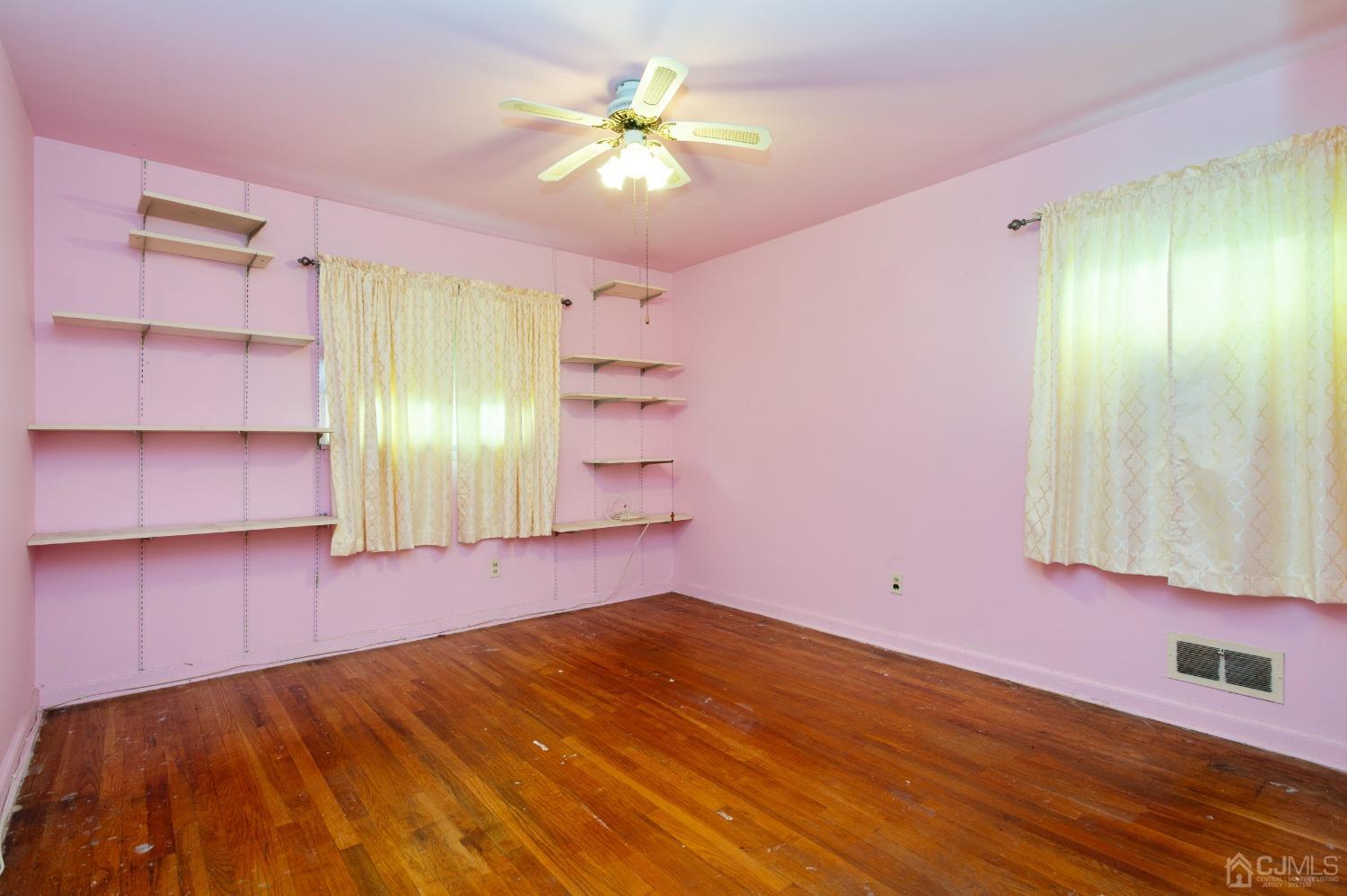 2 Leland Road Edison, NJ 08817 - Photo 12 of 25 a view of empty room with wooden floor and fan