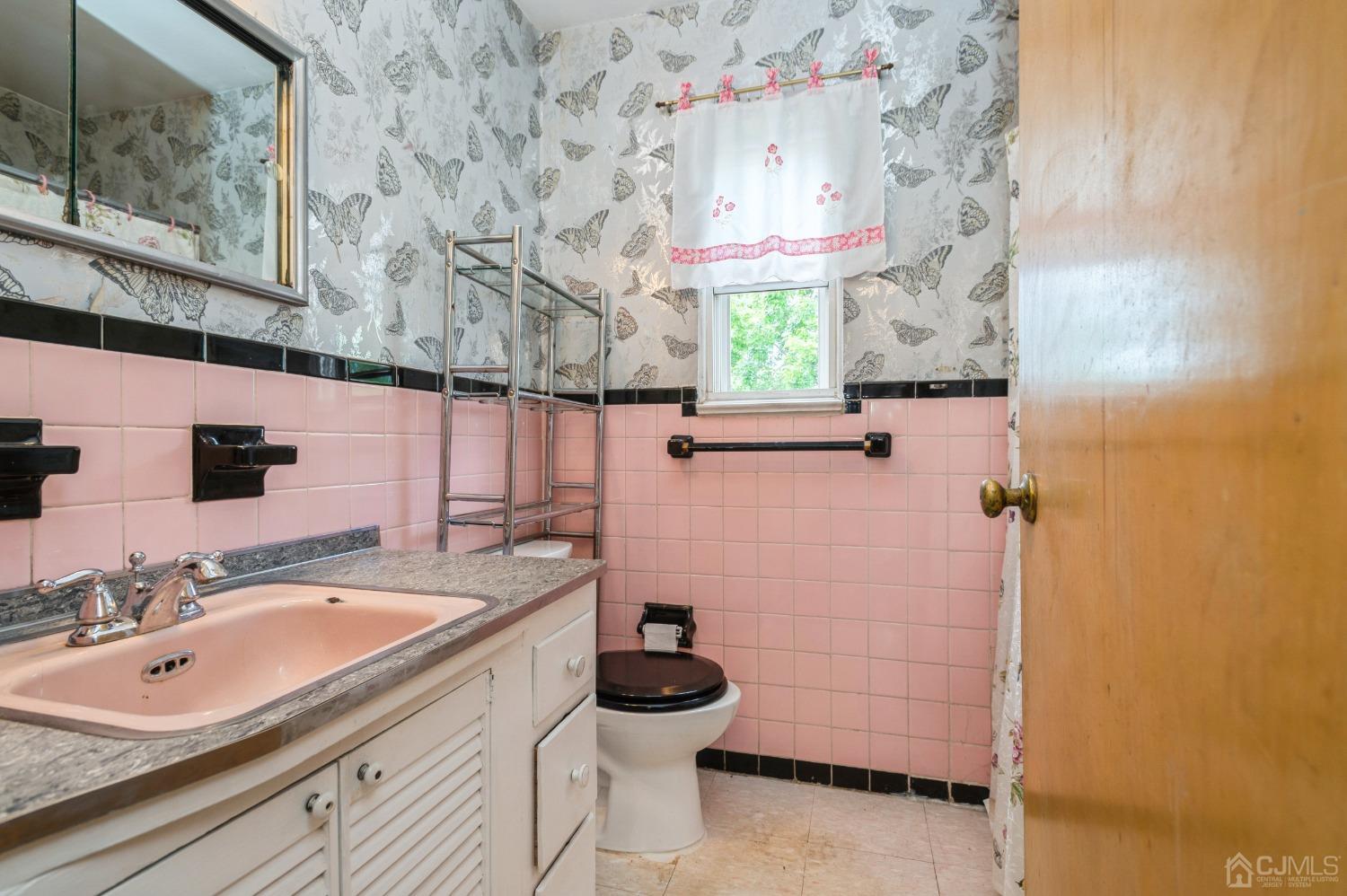 2 Leland Road Edison, NJ 08817 - Photo 14 of 25 a bathroom with a sink a vanity and mirror