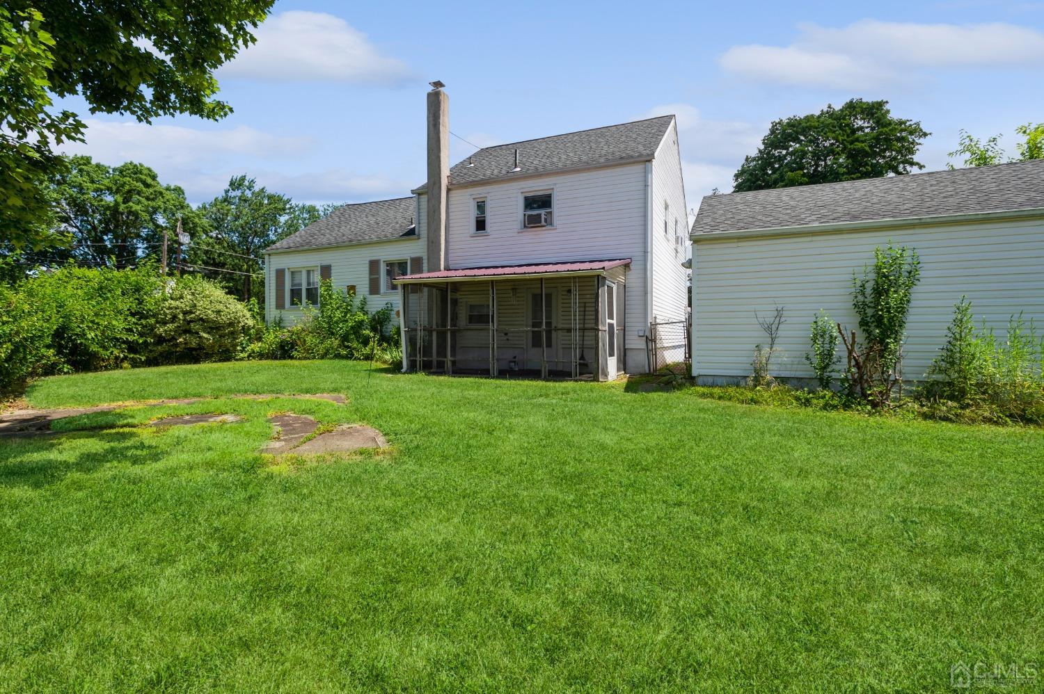 2 Leland Road Edison, NJ 08817 - Photo 20 of 25 a front view of house with yard and green space