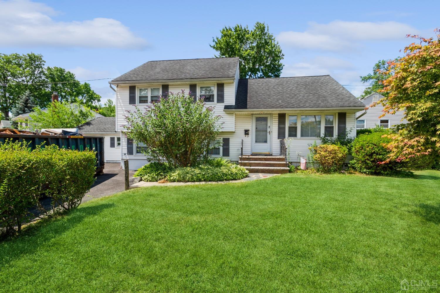 2 Leland Road Edison, NJ 08817 - Photo 3 of 25 a front view of a house with a yard and trees