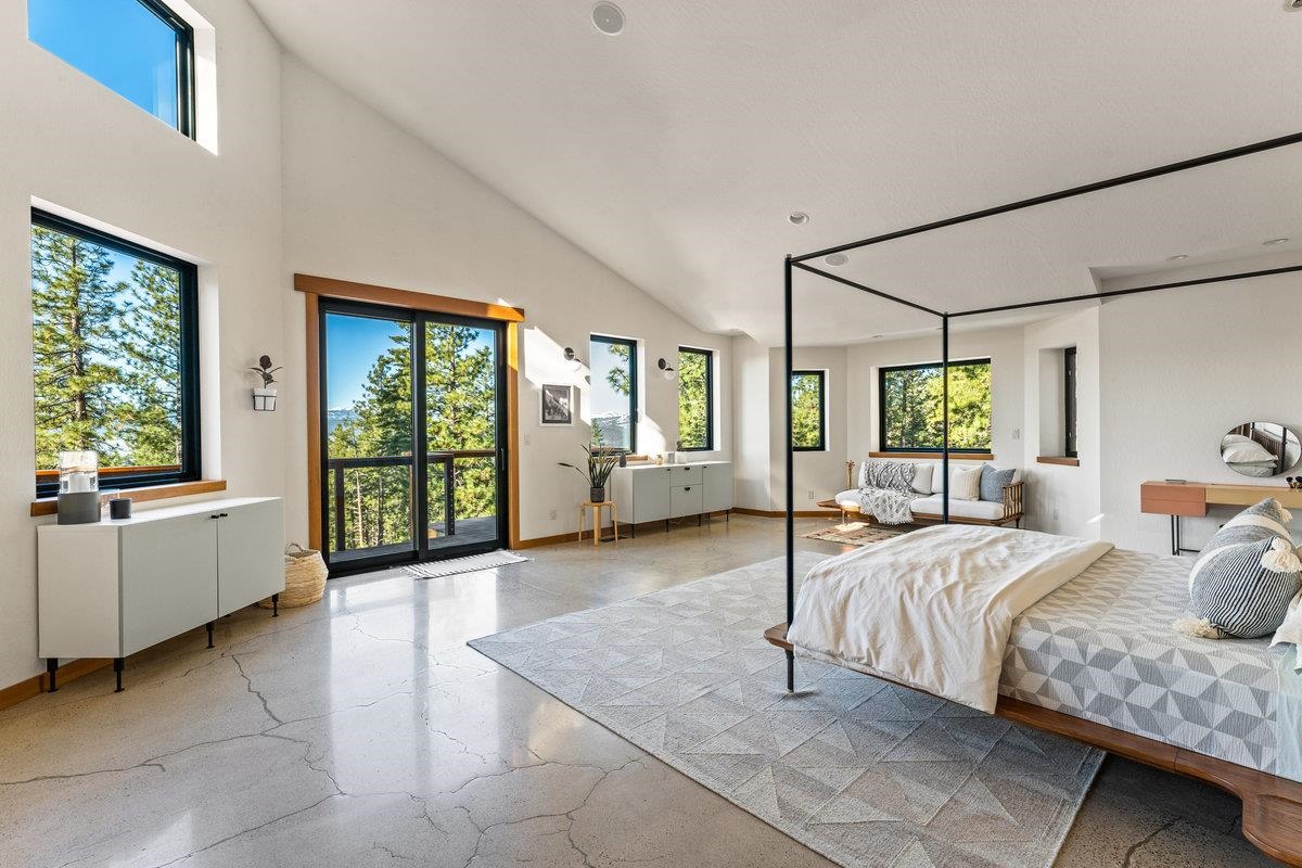 14802 Foxboro Drive Truckee, CA 96161 - Photo 14 of 21 a bedroom with a bed and large windows