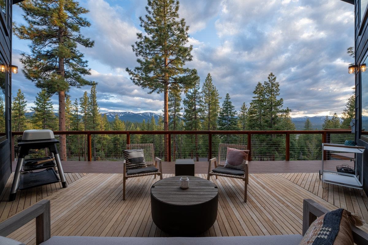 14802 Foxboro Drive Truckee, CA 96161 - Photo 2 of 21 a view of a balcony with wooden floor and outdoor seating