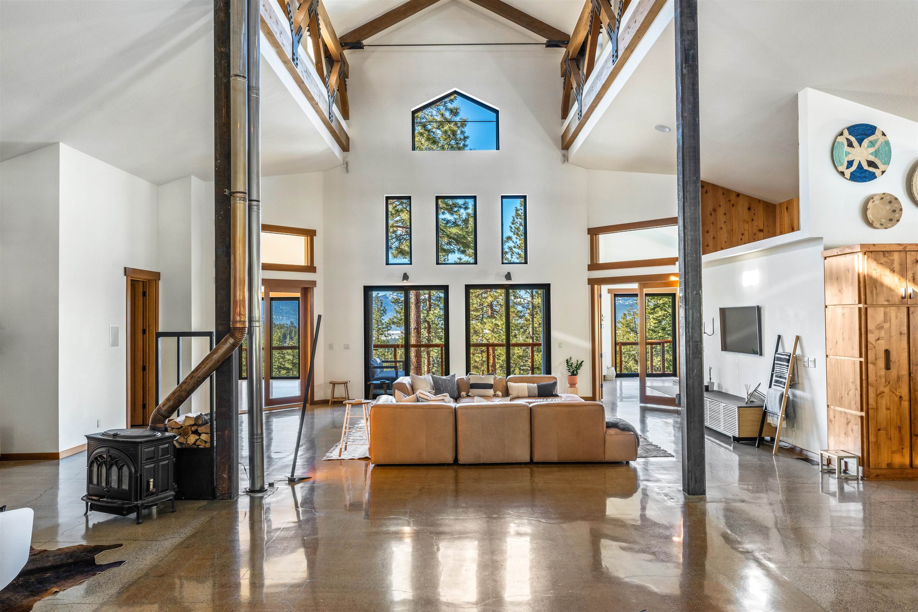 14802 Foxboro Drive Truckee, CA 96161 - Photo 6 of 21 a bedroom with furniture and a large window