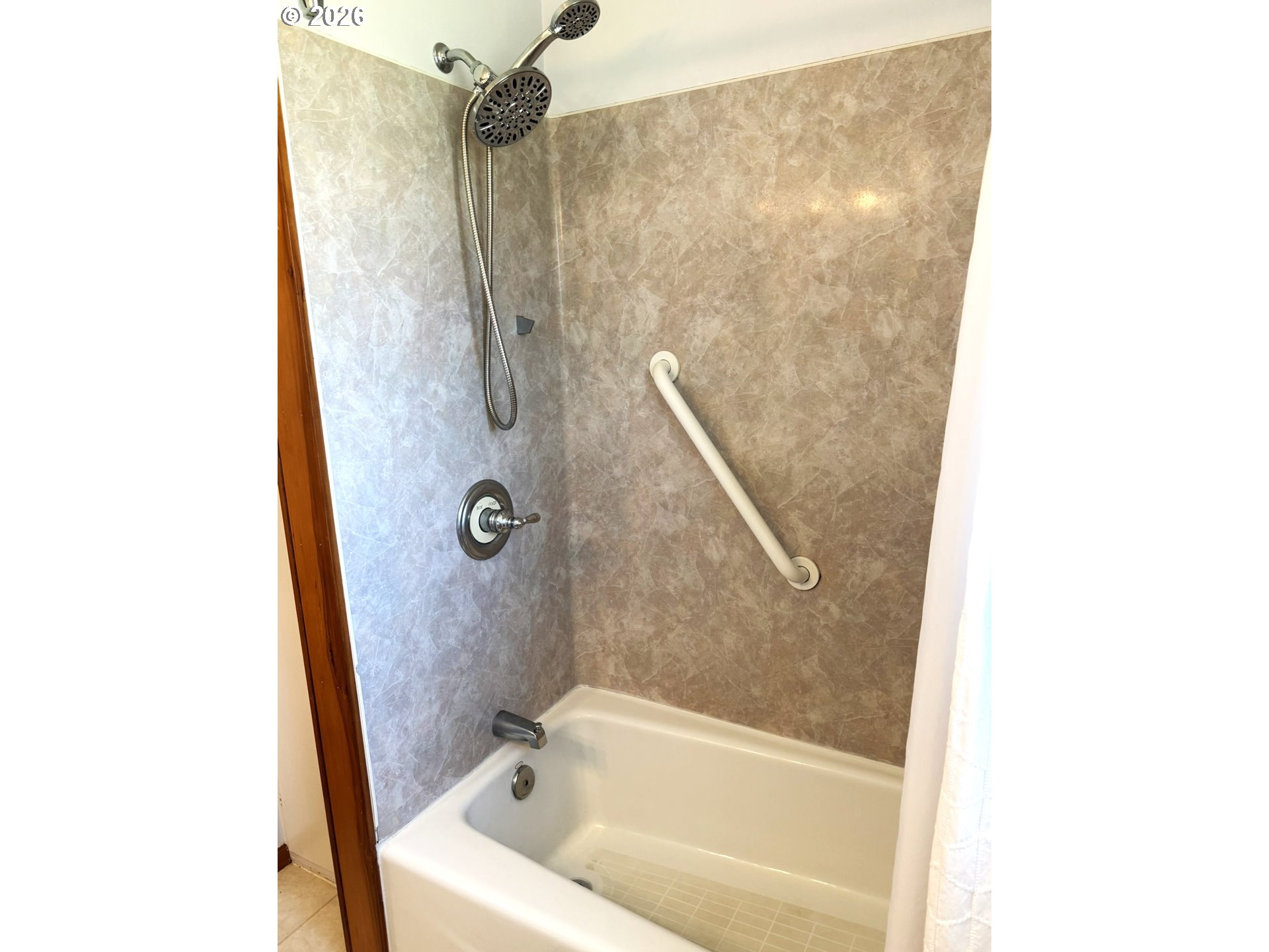1179 6th Street Florence, OR 97439 - Photo 26 of 26 a bathroom with a bathtub
