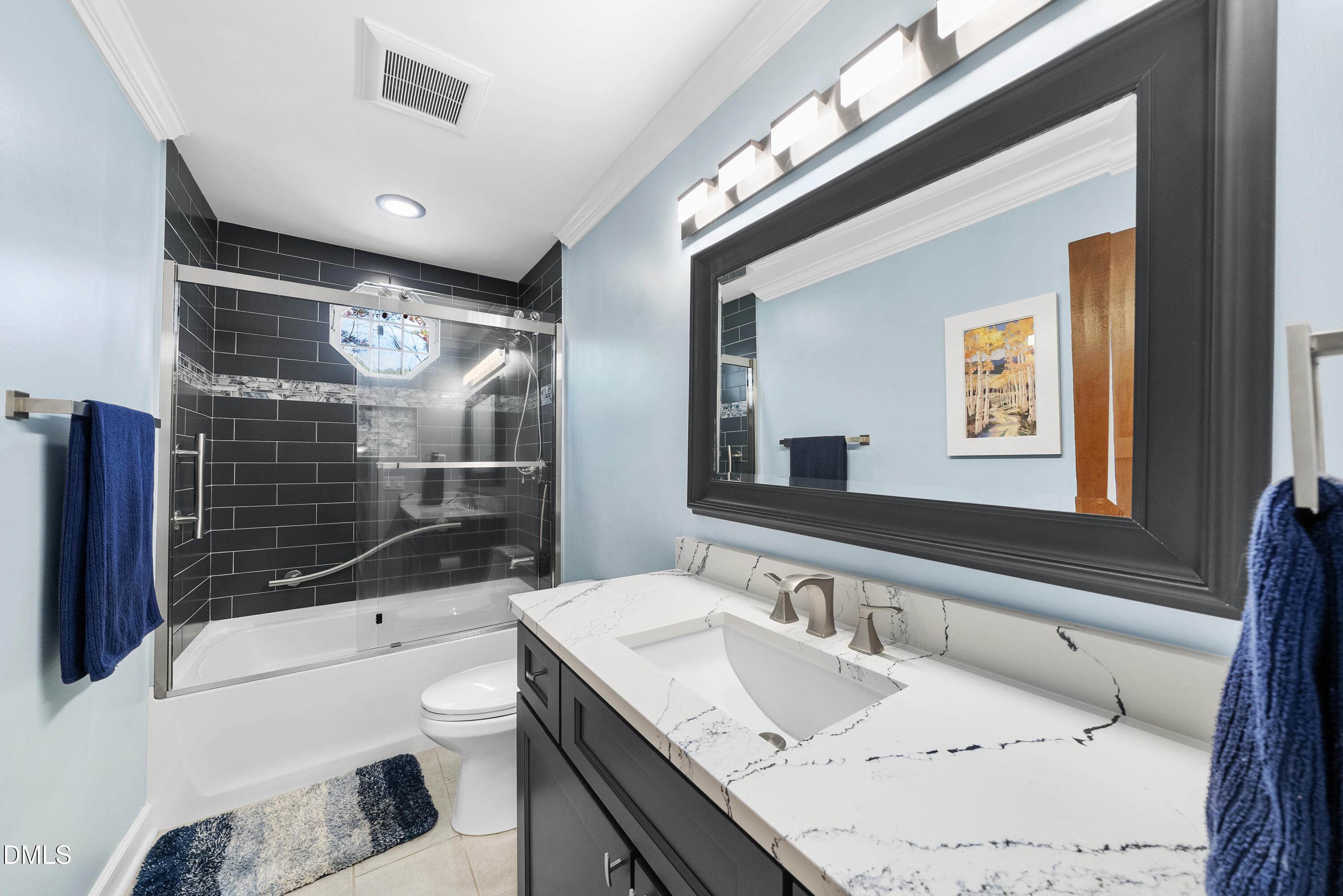 6200 Splitrock Trail Apex, NC 27539 - Photo 26 of 64 a bathroom with a sink a toilet and shower