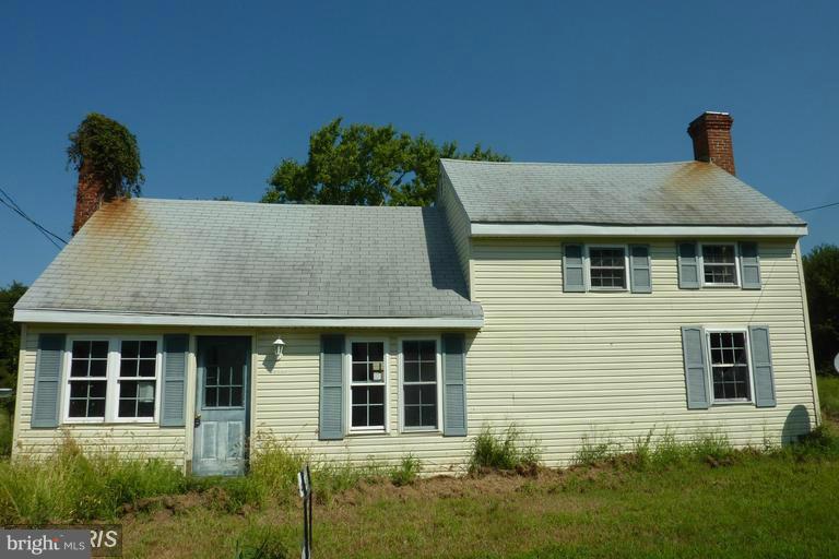 2248 Elliott Island Road Vienna, MD 21869 - Photo 1 of 10 a front view of a house with a yard