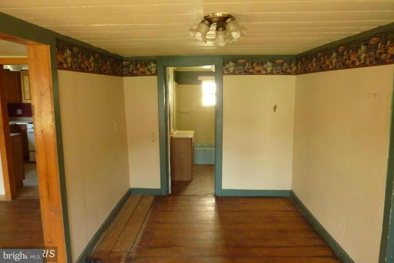 2248 Elliott Island Road Vienna, MD 21869 - Photo 3 of 10 a view of a hallway with wooden floor