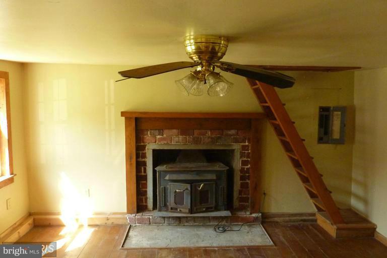 2248 Elliott Island Road Vienna, MD 21869 - Photo 5 of 10 a living room with a fireplace