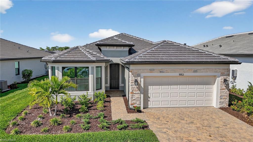 1953 Fresno Avenue Naples, FL 34120 - Photo 1 of 33 front view of a house with a yard