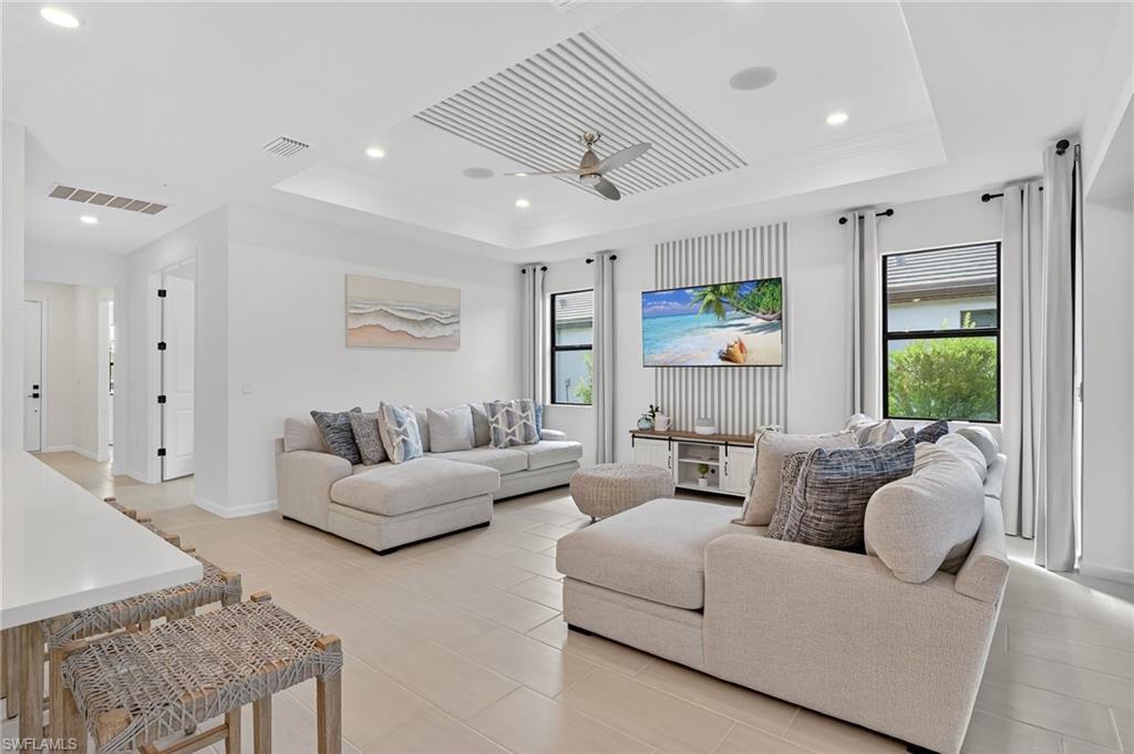 1953 Fresno Avenue Naples, FL 34120 - Photo 13 of 33 a living room with furniture and a large window