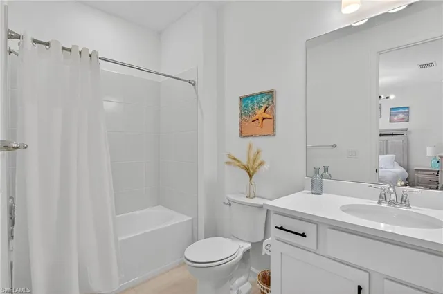 a bathroom with a sink a toilet and a bathtub