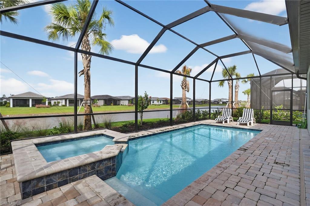 1953 Fresno Avenue Naples, FL 34120 - Photo 17 of 33 a view of swimming pool with outdoor seating