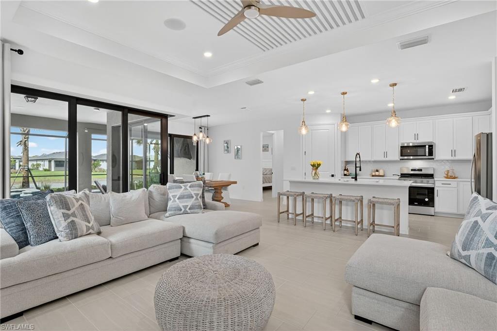 1953 Fresno Avenue Naples, FL 34120 - Photo 24 of 33 a living room with furniture kitchen and a large window