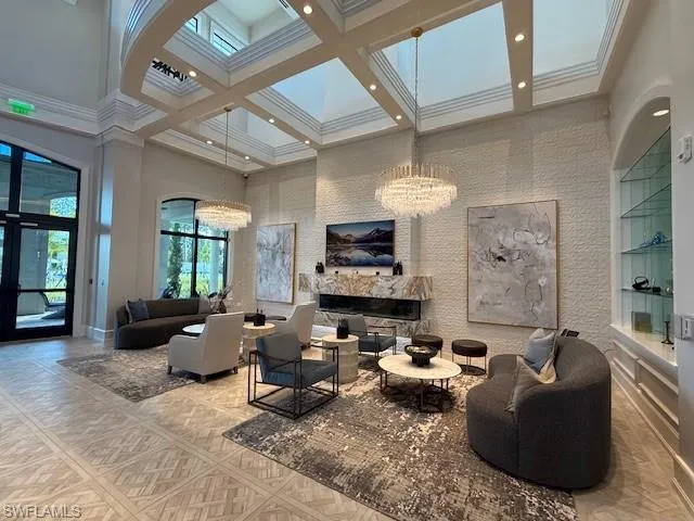 a view of a dining area with furniture and a chandelier