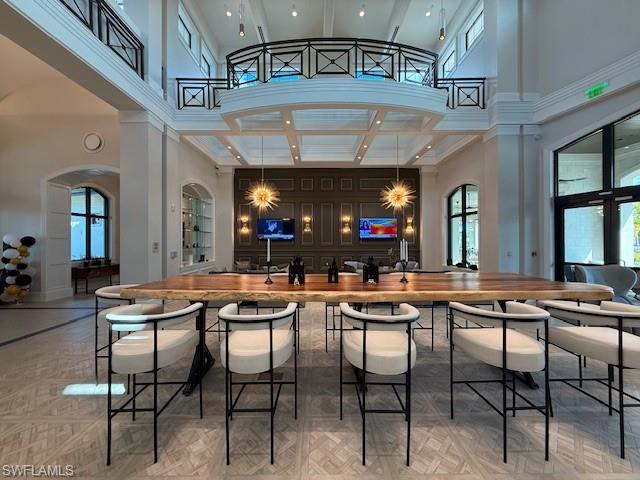 1953 Fresno Avenue Naples, FL 34120 - Photo 29 of 33 a view of a dining area with furniture and a chandelier