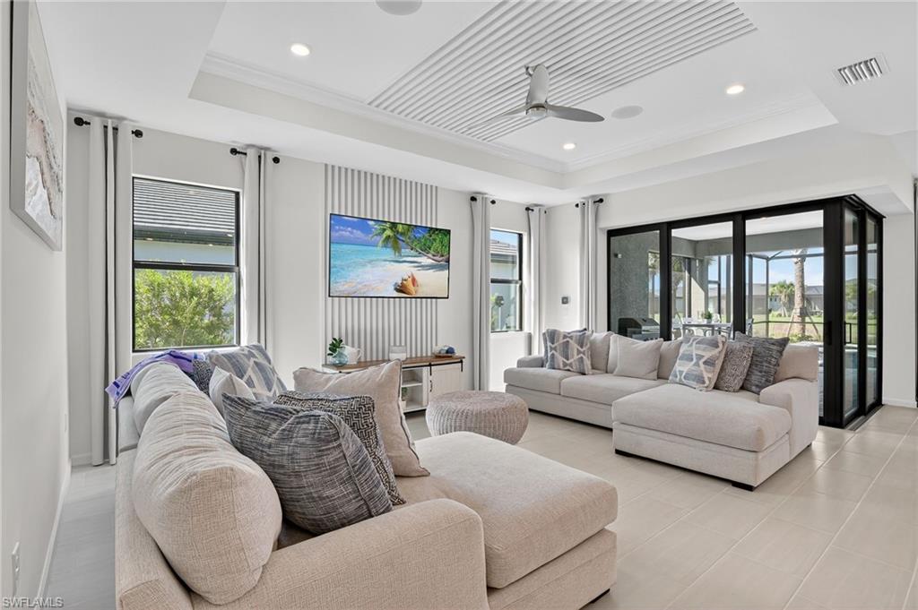 1953 Fresno Avenue Naples, FL 34120 - Photo 5 of 33 a living room with furniture and large windows
