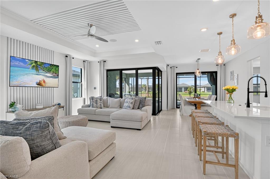 1953 Fresno Avenue Naples, FL 34120 - Photo 6 of 33 a living room with furniture and a large window