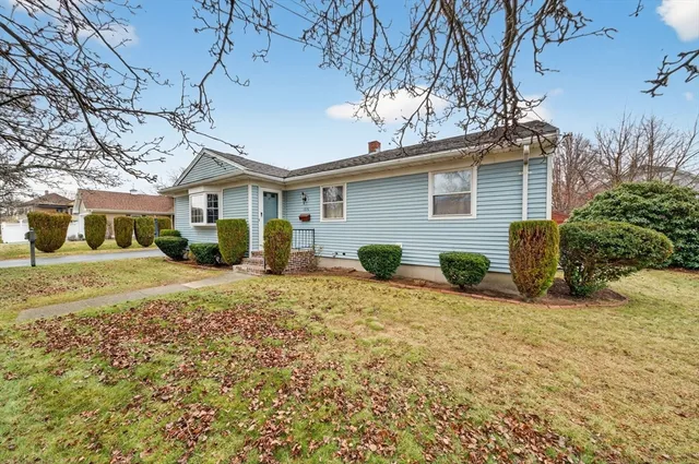 a front view of a house with a yard